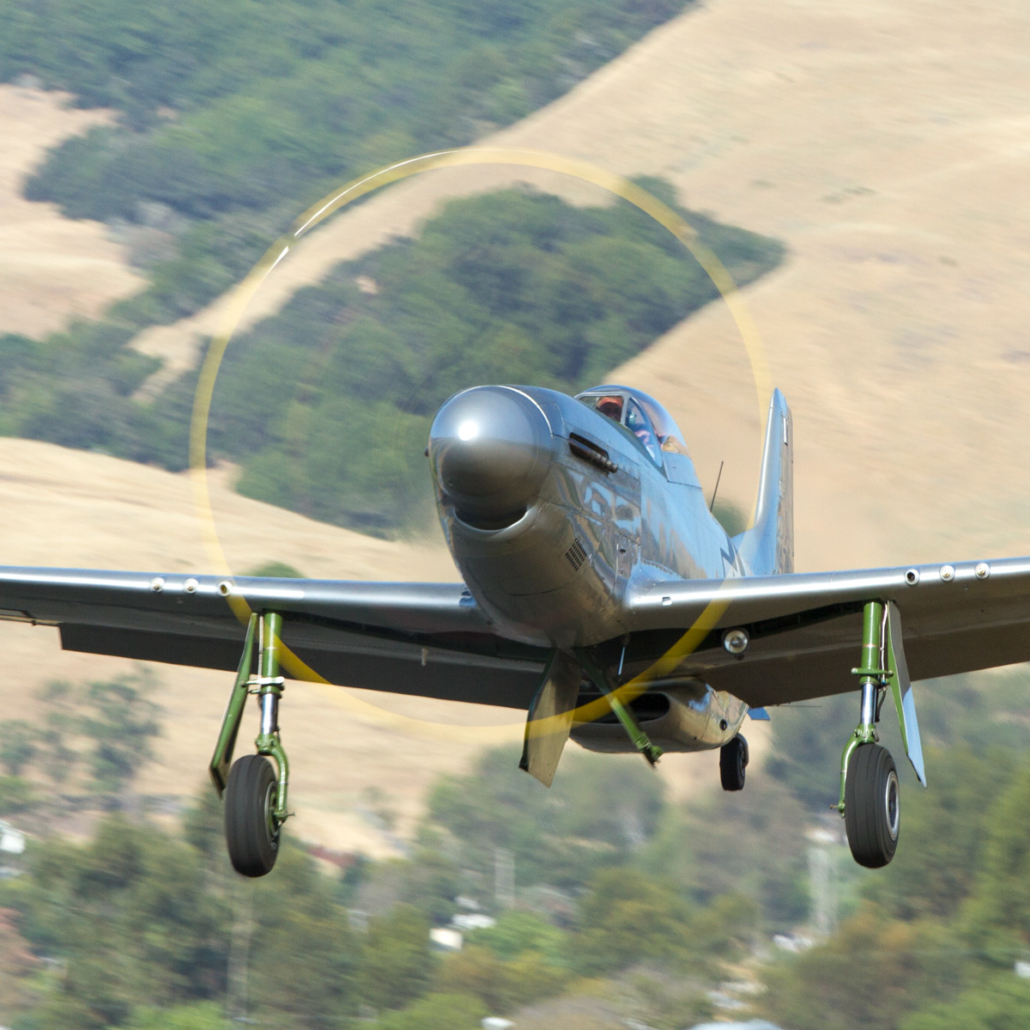 P-51 Mustang taking off from runway